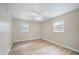 A bright bedroom with hardwood floors, a ceiling fan, and natural light at 2813 21St W Ave, Bradenton, FL 34205