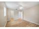 A bright bedroom with hardwood floors, a ceiling fan, and neutral paint at 2813 21St W Ave, Bradenton, FL 34205