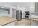 Bright kitchen boasts stainless steel appliances, white cabinets, and a butcher block countertop at 2813 21St W Ave, Bradenton, FL 34205