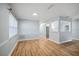 Open living room featuring wood-look floors and lots of natural light at 2813 21St W Ave, Bradenton, FL 34205