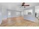 Bright living room with a ceiling fan and wood-look flooring at 2813 21St W Ave, Bradenton, FL 34205
