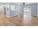 Stylish living room with wood-look flooring and view of the kitchen and lanai at 2813 21St W Ave, Bradenton, FL 34205