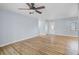 Spacious living room featuring wood-look floors and a modern ceiling fan at 2813 21St W Ave, Bradenton, FL 34205
