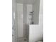 A modern shower with a decorative tile accent stripe and tiled floor at 2813 21St W Ave, Bradenton, FL 34205
