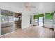 Bright sunroom featuring tiled floors, sliding glass doors, and a ceiling fan at 2813 21St W Ave, Bradenton, FL 34205