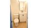 Cozy bathroom includes a single vanity, toilet, and a well-lit mirror at 530 74Th N Ave, St Petersburg, FL 33702