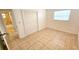 Bedroom with tile flooring offers a closet space with an attached bathroom creating a harmonious flow at 530 74Th N Ave, St Petersburg, FL 33702