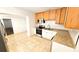 Efficient kitchen includes stainless appliances, light wood cabinets, and durable countertops at 530 74Th N Ave, St Petersburg, FL 33702