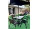 Inviting backyard patio with an outdoor table and chairs, ideal for relaxing and dining al fresco, plus a hanging swing chair at 6320 Cedar St Ne, St Petersburg, FL 33702