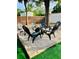 Charming backyard area with a fire pit surrounded by Adirondack chairs, creating an inviting space for outdoor gatherings at 6320 Cedar St Ne, St Petersburg, FL 33702