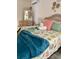 Comfortable bedroom with a wicker bed frame, complemented by coastal-themed decor and natural light at 6320 Cedar St Ne, St Petersburg, FL 33702