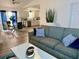 Bright and airy living room with modern furniture, seamlessly connected to the dining area and kitchen at 6320 Cedar St Ne, St Petersburg, FL 33702