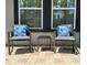 Cozy front patio featuring two comfortable chairs and a small table, creating an inviting outdoor seating area at 6320 Cedar St Ne, St Petersburg, FL 33702