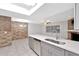 Updated kitchen features a peninsula with a sink and stainless steel appliances at 15609 Timberline Dr, Tampa, FL 33624