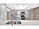 Modern kitchen with stainless steel appliances and eat-in bar at 15609 Timberline Dr, Tampa, FL 33624