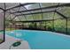 Beautiful pool area with lush landscaping, offering a private and serene outdoor experience at 15609 Timberline Dr, Tampa, FL 33624