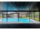 Backyard oasis featuring a screened-in pool area at 15609 Timberline Dr, Tampa, FL 33624