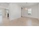 Dining area with modern chandelier and large window for natural light, seamless flow into kitchen at 11314 Grand Park Ave, Riverview, FL 33578