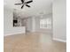 Spacious living room featuring neutral tile flooring, abundant natural light, and an open layout at 11314 Grand Park Ave, Riverview, FL 33578