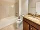 Standard bathroom features a combined shower and bathtub, with tile flooring and a granite-topped vanity at 19491 Paddock View Dr, Tampa, FL 33647