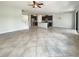 Open-concept living space integrates the kitchen and staircase, with tile flooring throughout at 19491 Paddock View Dr, Tampa, FL 33647