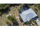 Close aerial featuring home with a pool, driveway, and landscaping at 5769 E Price Blvd, North Port, FL 34288
