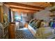 Bonus room with a high ceiling, bookshelf, and comfortable daybed at 5769 E Price Blvd, North Port, FL 34288