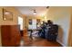 Office space with built-in shelving, hardwood floors, and a ceiling fan at 5769 E Price Blvd, North Port, FL 34288