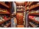 Spacious walk-in closet with custom shelving and drawers for organized storage at 5769 E Price Blvd, North Port, FL 34288
