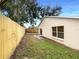 Fenced backyard featuring grass and trees at 9855 Morris Glen Way, Temple Terrace, FL 33637