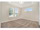 Cozy bedroom with neutral carpet, natural light and recessed lighting at 9955 Patrician Dr, New Port Richey, FL 34655