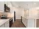 Stylish kitchen featuring a center island with quartz countertops and stainless appliances at 9955 Patrician Dr, New Port Richey, FL 34655