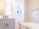 Clean bathroom featuring a vanity and mirror, and a shower and tub at 14073 Naylor Ave, Port Charlotte, FL 33981