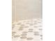Unique hexagonal tile flooring in a modern bathroom at 14073 Naylor Ave, Port Charlotte, FL 33981