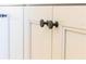 Detailed cabinet doors with black hardware accents the modern design in this space at 14073 Naylor Ave, Port Charlotte, FL 33981