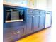 Kitchen island with a microwave, under-counter cabinets and drawers, and a built-in dishwasher at 14073 Naylor Ave, Port Charlotte, FL 33981