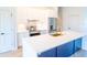 Modern kitchen featuring stainless steel appliances, and an island with white countertops at 14073 Naylor Ave, Port Charlotte, FL 33981