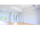 Open concept living room with wood floors and a double door at 14073 Naylor Ave, Port Charlotte, FL 33981