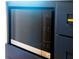 Modern LG microwave with touch panel built into navy cabinetry for a seamless kitchen aesthetic at 14073 Naylor Ave, Port Charlotte, FL 33981