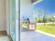 Outdoor kitchen with stainless grill, beverage cooler, and tile flooring at 14073 Naylor Ave, Port Charlotte, FL 33981