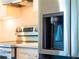New stainless steel refrigerator with water dispenser in a modern kitchen at 14073 Naylor Ave, Port Charlotte, FL 33981