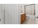 Bathroom featuring neutral colors, cabinet storage, sink, and toilet at 15364 Mount Sparrow Rd, Weeki Wachee, FL 34614