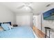 Bedroom features wood floors, closet, and an open door to the other rooms in the house at 15364 Mount Sparrow Rd, Weeki Wachee, FL 34614