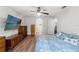 Bright bedroom with wood floors and view to the hallway at 15364 Mount Sparrow Rd, Weeki Wachee, FL 34614
