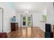 Open dining area with access to backyard via French doors and hardwood floors at 15364 Mount Sparrow Rd, Weeki Wachee, FL 34614