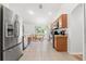 An open kitchen with stainless steel appliances and a large window allowing for plenty of natural light at 15364 Mount Sparrow Rd, Weeki Wachee, FL 34614