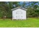 Outdoor shed with a clean design adds extra storage at 15364 Mount Sparrow Rd, Weeki Wachee, FL 34614