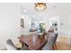 Elegant dining table setting with views into the open-concept living area at 2556 Arborwood Dr, Valrico, FL 33596