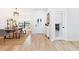Bright entryway featuring wood floors, a decorative light fixture, and an open dining area at 2556 Arborwood Dr, Valrico, FL 33596