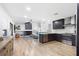 Open concept living area with modern kitchen featuring stainless steel appliances at 2556 Arborwood Dr, Valrico, FL 33596